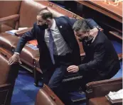  ?? J. SCOTT APPLEWHITE/AP ?? LEFT: Lawmakers evacuate the floor as protesters try to break into the House Chamber at the U.S. Capitol on Wednesday.