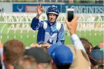  ?? GETTY IMAGES ?? Hugh Bowman gives his trademark salute to the Rosehill crowd.