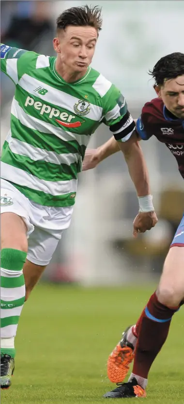  ??  ?? Ronan Finn of Shamrock Rovers tussles with Drogheda’s Ciaran McGuigan during Friday’s clash at Tallaght