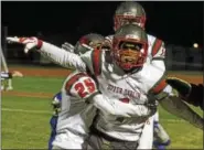  ?? RICK KAUFFMAN — DIGITAL FIRST MEDIA U ?? Upper Dublin cornerback Selvin Haynes celebrates with teammates after a fourth-down stop that sealed the Cardinals’ 17-12 victory.