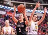  ??  ?? Top, Boyertown players celebrate with the PIAA trophy after defeating North Allegheny in the PIAA Class 6A title game Friday night at the GIANT Center in Hershey. Bottom, Boyertown celebrates their victory over North Allegheny. Right, Alli Marcus (5)...