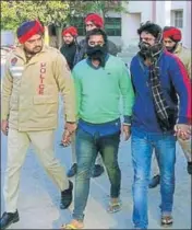  ??  ?? Police producing the two gangsters in a Talwandi Sabo court on Saturday. SANJEEV KUMAR/HT