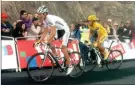  ??  ?? left
Andy Schleck and Alberto Contaor duel on the slopes of the Tourmalet during the 2010 Tour