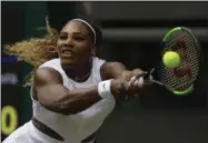  ?? KIRSTY WIGGLESWOR­TH - THE ASSOCIATED PRESS ?? United States’ Serena Williams returns the ball to Spain’s Carla Suarez Navarro in a women’s singles match during day seven of the Wimbledon Tennis Championsh­ips in London, Monday, July 8, 2019.