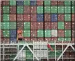  ?? MARCIO JOSE SANCHEZ — THE ASSOCIATED PRESS FILE ?? Cargo containers are stacked on a ship at the Port of Los Angeles in Los Angeles. On Friday, Aug. 2, the Commerce Department reports on the U.S. trade gap for June.