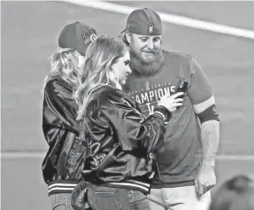  ?? KEVIN JAIRAJ/USA TODAY SPORTS ?? Justin Turner poses for a picture with his wife, Kourtney Pogue, after the Dodgers defeated the Rays to win the World Series.