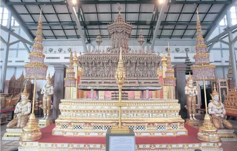  ??  ?? ITEMS OF LORE: The ornate sandalwood outer casing of the royal urn and some decorative pieces used at the royal cremation last October were put on public display at the National Museum.