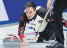  ?? ANDREW VAUGHAN THE CANADIAN PRESS ?? Ontario skip John Epping releases a rock against Saskatchew­an at the Tim Hortons Brier curling championsh­ip in Regina on Wednesday.