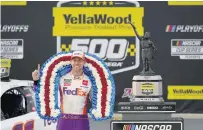  ?? JOHN BAZEMORE/ASSOCIATED PRESS ?? Denny Hamlin savors his victory Sunday at Talladega Superspeed­way in a race that lasted about 32 miles longer than expected.