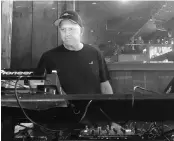  ?? PHOTO: REUTERS ?? Goldman Sachs Co-President and Co-COO David Solomon plays disc jockey at a lounge in New York City