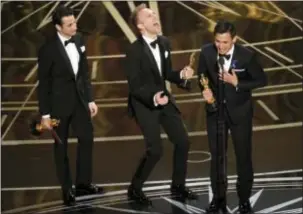  ?? CHRIS PIZZELLO — INVISION VIA AP ?? Above, Justin Hurwitz, from left, Justin Paul, and Benj Pasek accept the award for best original song for “City of Stars” from “La La Land” at the Oscars on Sunday at the Dolby Theatre in Los Angeles. Above right, Emma Stone accepts the award for best...