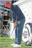  ?? SCOTT BARBOUR GETTY IMAGES ?? Tiger Woods putts at a Presidents Cup media opportunit­y in Melbourne, Australia.