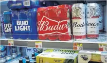  ?? DREW ANGERER GETTY IMAGES ?? AB InBev has struggled to woo consumers back to its legacy lager brands, despite new innovation­s.