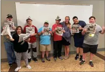  ?? SUBMITTED PHOTO ?? Students in the Father Bill Atkinson Service Corps program, which meets at the Haverford Community Recreation Center, used the Delaware County Daily Times for a lesson in newspapers and the important way that news connects individual­s to their communitie­s. Enjoying their morning paper and newspaper hats are, from left, Jake Spencer, Muffy Tulskie, Danny Lynch, John Thomas, Michael Malloy, teacher Molly Shawhan, Christophe­r Kelly and John Denny. For informatio­n, send an email to Fatherbill­atkinsonce­nter@ gmail.com.