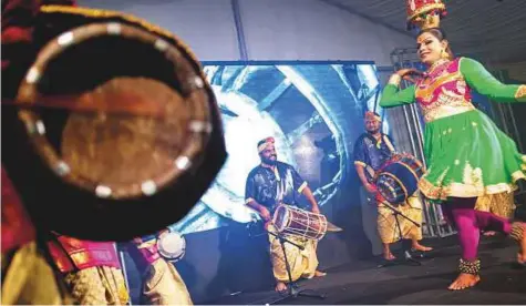  ?? AFP ?? Malaysian musicians of Indian ethnicity take part in an ‘urumee melam’ performanc­e in Bukit Sentosa, around 50 kilometres outside Kuala Lumpur. The festival, held recently, brought together several bands.