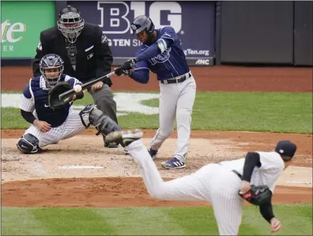  ?? FRANK FRANKLIN II - THE ASSOCIATED PRESS ?? Tampa Bay Rays’ Manuel Margot hits a two-run home run during the fourth inning of a baseball game against the New York Yankees, Saturday, April 17, 2021, in New York.