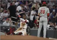  ?? 28 ?? Atlanta Braves’ Ozzie Albies, left, celebrates beside Philadelph­ia Phillies third baseman Alec Bohm