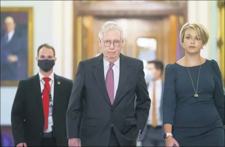  ?? J. SCOTT APPLEWHITE — THE ASSOCIATED PRESS ?? Senate Minority Leader Mitch McConnell, R-Ky., returns to his office from the Senate chamber before votes, at the Capitol in Washington, Sept. 30.