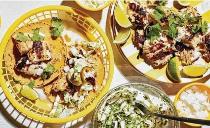  ?? Stacy Zarin Goldberg / For the Washington Post ?? After the marinating time, Citrus-Marinated Fish Tacos quickly come together.