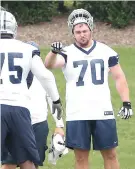  ?? Brandon Wade/Associated Press ?? ■ Dallas Cowboys offensive guard Zack Martin (70) participat­es in a practice Tuesday at the NFL football team's training camp in Frisco, Texas.