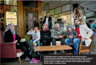  ??  ?? A Palestinia­n family, refugees from Syria, who recently arrived in Palmerston North, make themselves at home in George St after a welcome powhiri at the City Library. From left, Abir Ramdan Tamim, Mohammad Haydar Tamim, 13, Nadia Tamim, Tammam Tamim,...