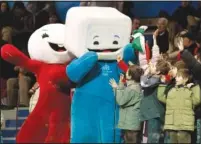  ?? (File Photo/AP/Amy Sancetta) ?? Children attending the short track skating races in the Palavela Arena cheer Feb. 15, 2006, with Torino Olympic mascots Neve (left) and Gliz at the 2006 Winter Olympics in Turin, Italy.