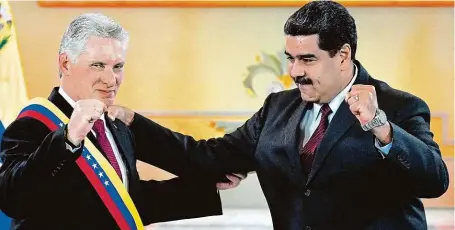 ?? FOTO PROFIMEDIA ?? S přítelem. Venezuelsk­ý prezident Maduro s kubánským protějškem Díazem-Canelem v prezidents­kém paláci Miraflores v Caracasu (květen 2018).