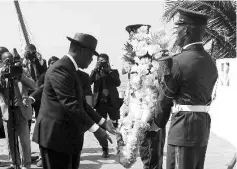  ??  ?? Ouattara prepares to lay a wreath for those killed in Sunday’s attack by Al Qaeda in the Islamic Maghreb, on a beach in Grand Bassam on Wednesday. — Reuters photo