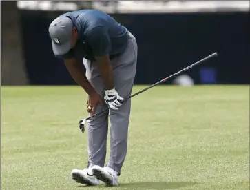  ?? Jeff Roberson ?? Tiger Woods reacts to his second shot on No. 8 on Thursday during the first round of the PGA Championsh­ip at Bellerive Country Club in St. Louis. Woods shot even-par 70 and is six shots behind.The Associated Press
