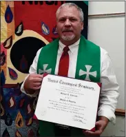  ?? ?? Plymouth’s Mike Ebersole is to become an ordained minister this Sunday in Bloomville. Pictured is Ebersole with his diploma from when he graduated seminary
Photo Courtesy of Mike Ebersole