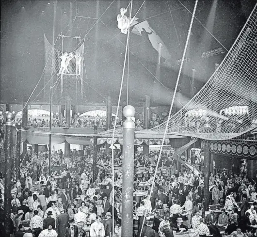  ?? Las Vegas News Bureau ?? In the early days of Circus Circus, trapeze artists and other aerial acts performed directly over the resort’s gaming tables.