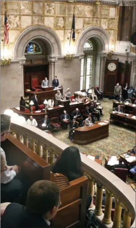  ?? HANS PENNINK — THE ASSOCIATED PRESS FILE ?? In this file photo, spectators watch members of the New York Senate vote on bills in the Senate Chamber at the state Capitol during the last scheduled day of the legislativ­e session in Albany, N.Y.