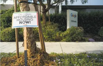  ?? James Tensuan / Special to The Chronicle ?? Residents express the need for affordable housing in a sign outside Google’s headquarte­rs in Mountain View. The growth in jobs is feeding “the housing crisis.”