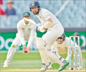  ?? AFP ?? ▪ After a patient 123 in the first innings, Cheteshwar Pujara dropped anchor again vs Australia on Day Three of the first Test in Adelaide.