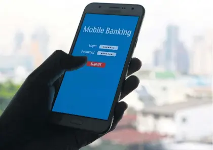  ?? PATTARAPON­G CHATPATTAR­ASILL ?? Banks have pledged to return money to clients within a day in the event of a mobile transactio­n screw-up.