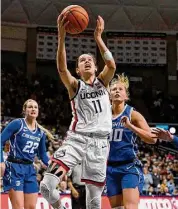  ?? Jessica Hill/Associated Press ?? UConn’s Lou Lopez Senechal shoots against Creighton during the second half on Wednesday in Storrs.