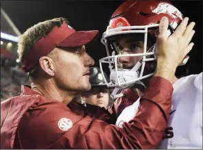  ?? NWA Democrat-Gazette/CHARLIE KAIJO ?? Arkansas Coach Chad Morris talks to quarterbac­k Ty Storey on Saturday after the Razorbacks’ 34-3 loss to No. 9 Auburn at Jordan-Hare Stadium in Auburn, Ala. Storey started his second game of the season for Arkansas.