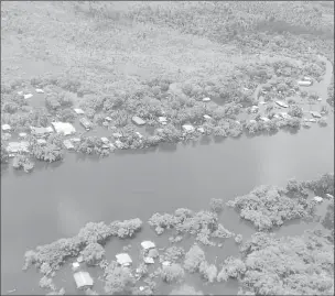  ??  ?? An overhead shot of flooding at Kwakwani in Region Ten (Civil Defence Commission photo)