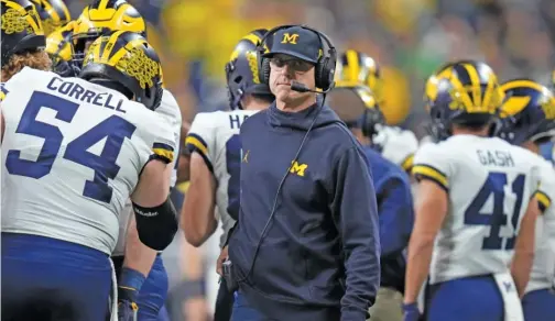  ?? AJ MAST/AP ?? A report Tuesday said Michigan coach Jim Harbaugh ‘‘might be tempted’’ to return to the NFL. His Wolverines finished 12-2 this season.