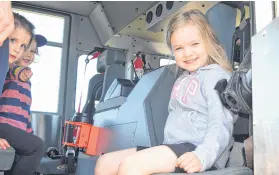  ?? FRAM DINSHAW/ TRURO NEWS ?? Children enjoyed the chance to sit in the cab of a fire truck. From left, Myla and Jett Wyle and Lexi Barbour.