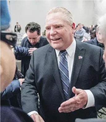  ?? DARREN BROWN ?? Ontario PC leadership candidate, Doug Ford, meets with supporters after speaking at a rally at the Infinity Convention Centre on Monday evening.
