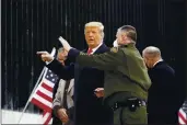  ?? ALEX BRANDON — THE ASSOCIATED PRESS ?? President Donald Trump tours a section of the U.S.-Mexico border wall under constructi­on in Alamo, Texas, on Tuesday.