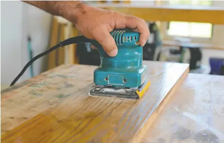  ?? ROBERT MAXWELL ?? Sanding lightly between coats of urethane is key to a smooth finish on interior wood.