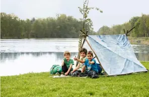  ?? ▯ Photograph­y: living4med­ia ?? The tent is complete, and Charlie, Josh and Tom try it out for size.