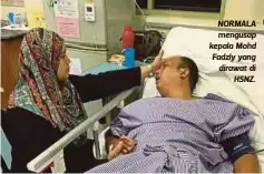  ??  ?? NORMALA mengusap kepala Mohd Fadzly yang dirawat di
HSNZ.
