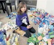  ?? Cliff Grassmick, Daily Camera ?? Harper McCarty, 7, got her school, neighborho­od and community to donate hygiene products to the OUR Center because she noticed a lot of people experienci­ng homelessne­ss in Longmont.