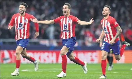  ?? REUTERS ?? From left: Mario Hermoso, Cesar Azpilicuet­a and Saul Niguez celebrate Atletico Madrid’s penalty shootout triumph over Inter Milan in the last 16 of the Champions League at Metropolit­ano Stadium in Madrid on Wednesday.