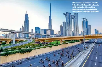  ?? Photos by Shihab ?? Bikers were excited to ride the 14km Sheikh Zayed Road route with both directions of the highway opened exclusivel­y for cyclists. —