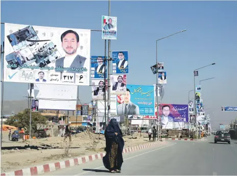  ?? AP ?? Campaign posters for young parliament­ary candidates are everywhere in Kabul for the country’s elections on October 20