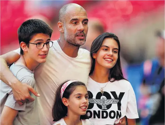  ?? PHOTO: REUTERS ?? Quite a team . . . Manchester City manager Pep Guardiola and his children (from left) Marius, Valentina and Maria celebrate after City beat Chelsea 20 to win the Community Shield at Wembley on Monday.